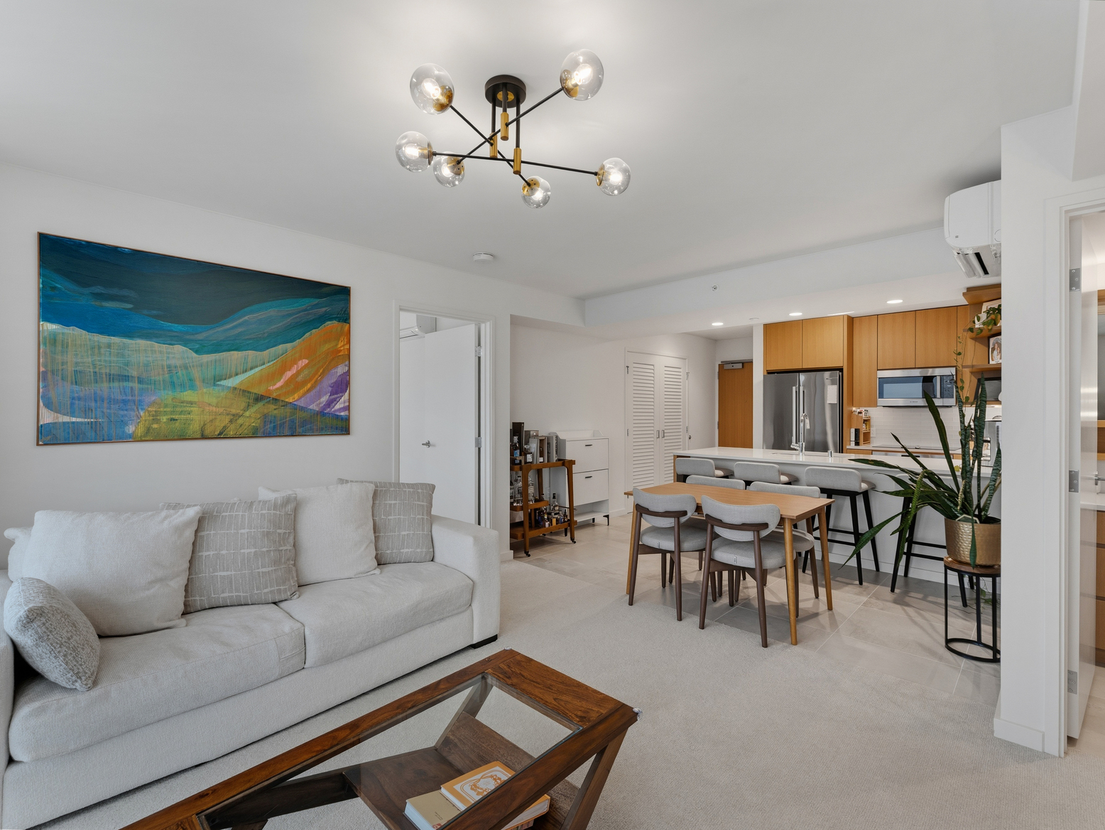 Open living and dining area beside the kitchen breakfast bar